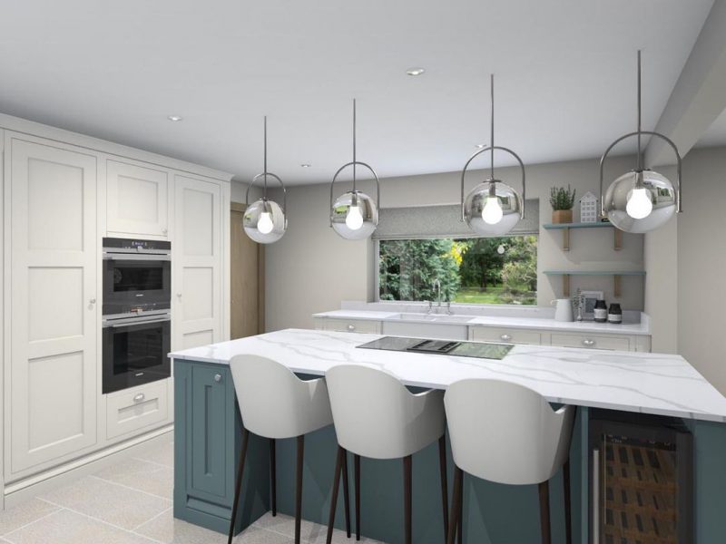 A finished kitchen by Colebarn Interior Design, Derbyshire. The kitchen is modern with lights hanging from the ceiling. The walls are painted in a light grey colour.